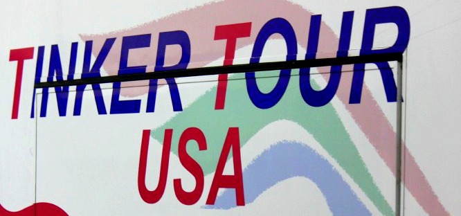 A decal on the side of the tour bus