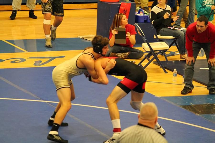 Senior Jacob Paddock puts his opponent in a hold.
