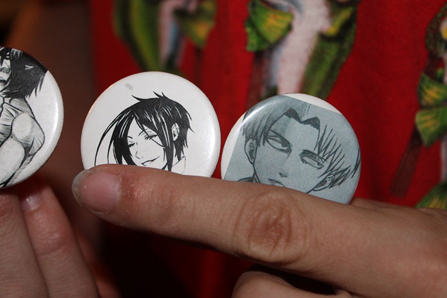 Art Club makes buttons for people to enjoy.