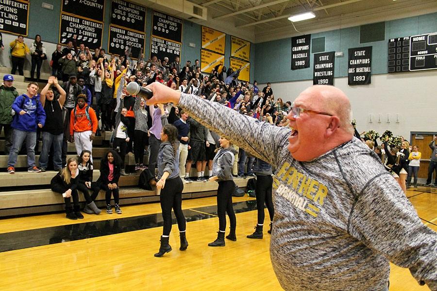 Finishing the famous roller coaster cheer, coach Brad Gaines leads the seniors at their last pep rally. Gaines is known for leading the cheer, both at pep rallys and at games.
