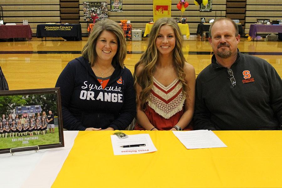 Toni Martin is joined by her parents as she signs to Syracuse University.