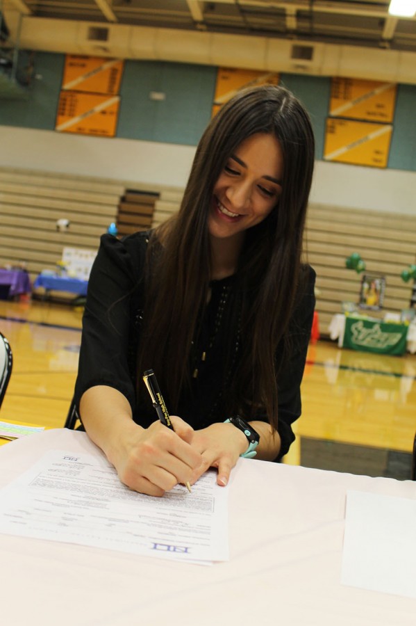 Kiley Deain signs to the University of South Florida to continue her running career.