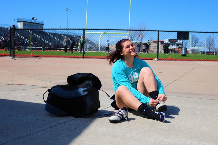 Soccer: Pure joy. Laughing and tying her cleats senior, goalie, Samantha Curphey gets ready for the soccer game against Blue Springs South. Sadly the finishing score was 5-2 panthers taking a loss. The Soccer team will have many more games ,both home and away, to come.

