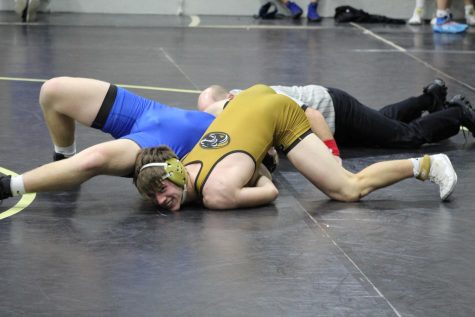 Sophomore Patrick Martin pursues wrestling with an injury